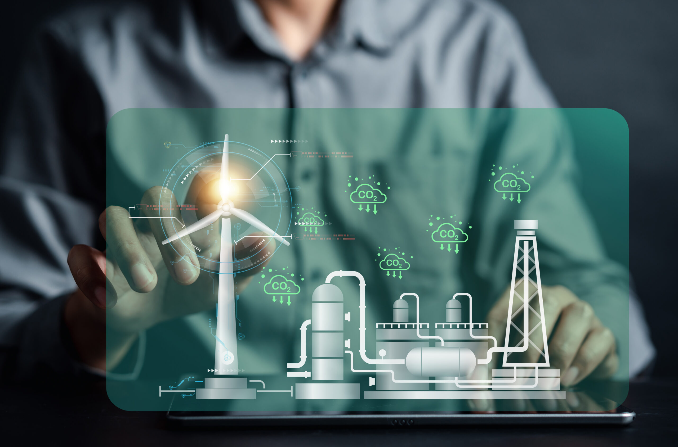 Energy engineer using tablet virtual wind turbine farm with map future, prototype design on holographic projection, Futuristic design with technology application basic, Green energy concept.